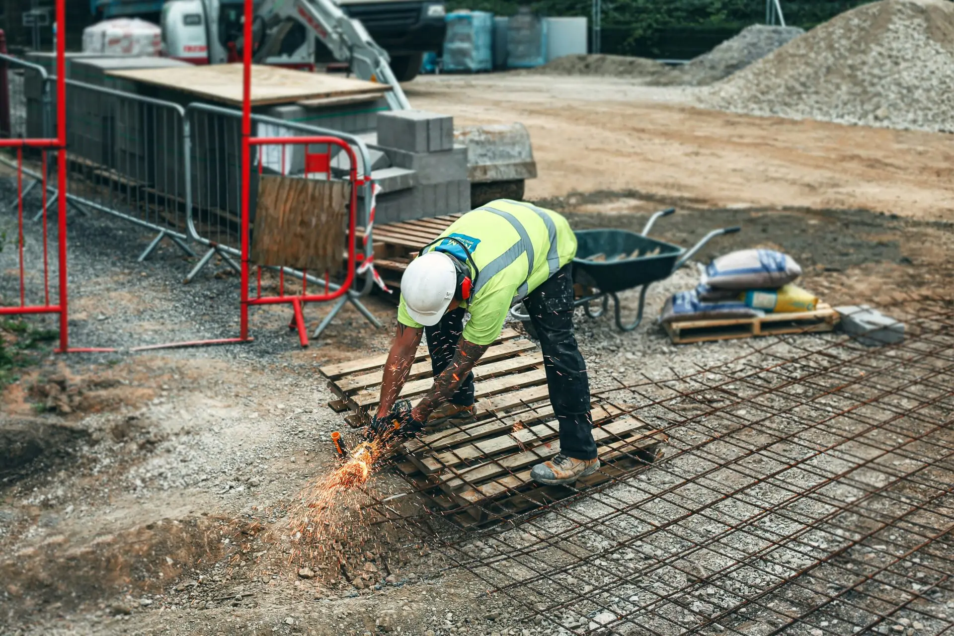 construction propane worker cutting metal